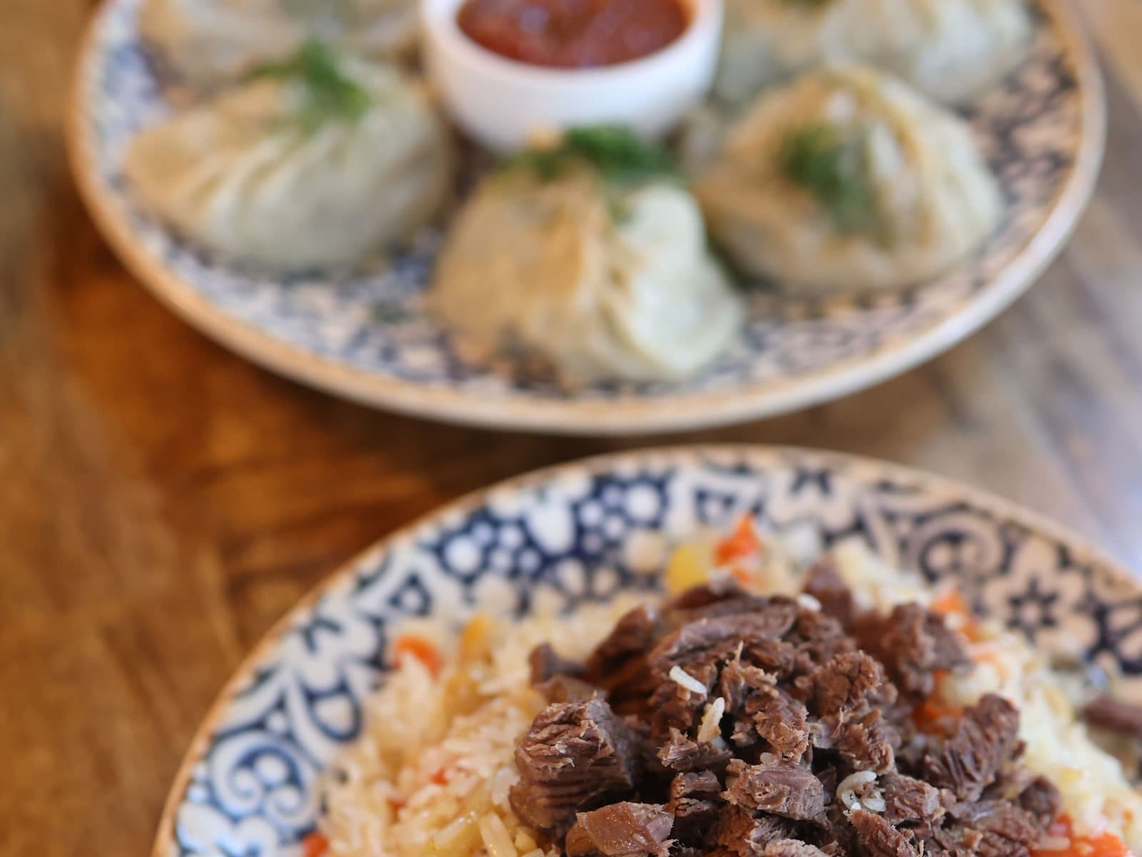 Beef pulao on a patterned plate