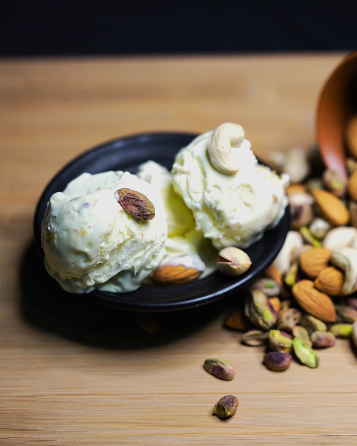 Ice cream scoops with pistachios and almonds